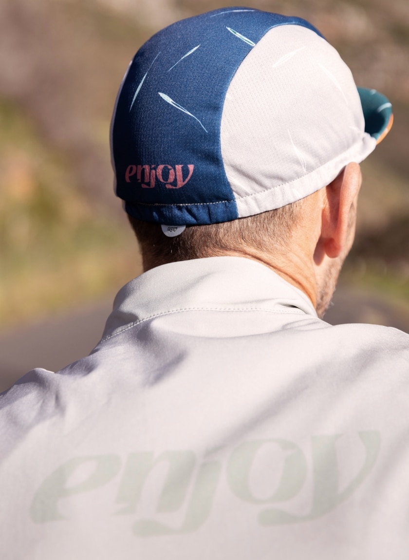 Close up of the mens Drifit casquette featuring the Avena design available at Enjoy.cc