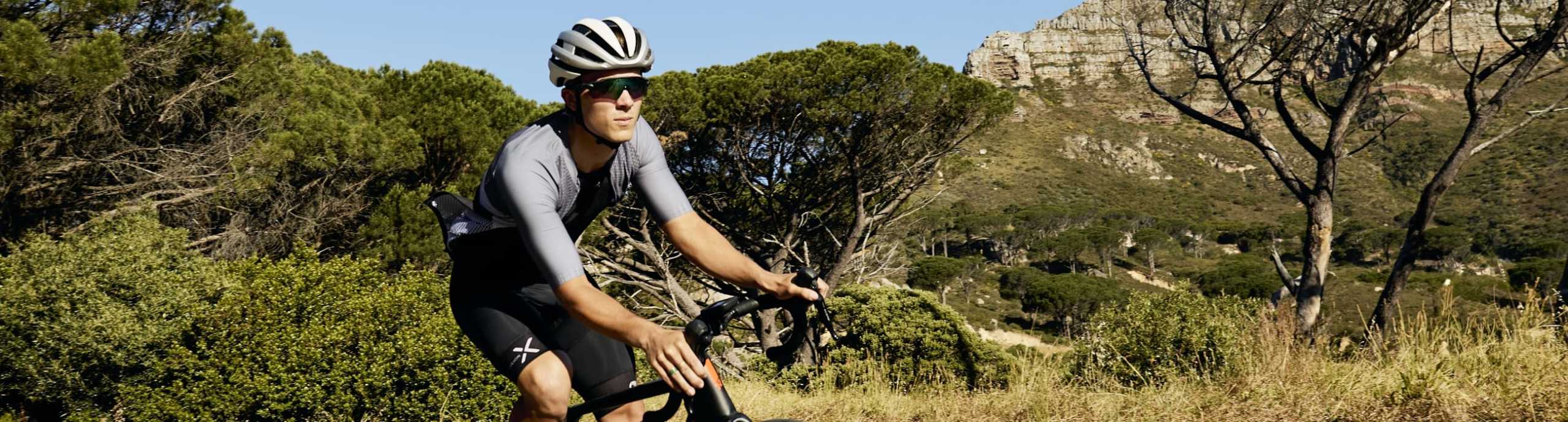 Male cyclist wearing Enjoy Climber cycling jersey
