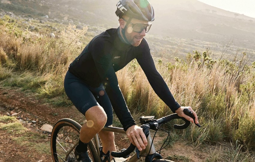 Male cyclist wearing Cocoon thermal long sleeve cycle jersey made by enjoy.cc