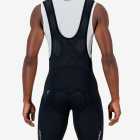 Back view of the Enjoy Dual men's bib short in black with reflective detailing made by enjoy.cc.