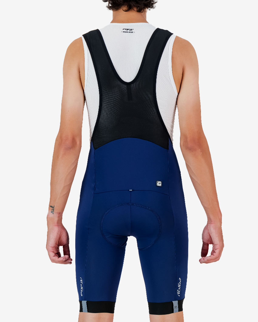 Back view of the Enjoy Octane men's bib short in navy with reflective detail made by Enjoy.cc