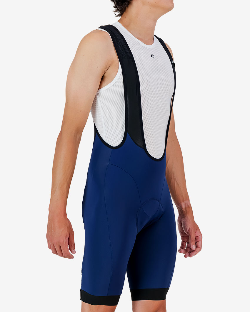 Mens-Bib-short-Octane-Navy-Side Side view of the Enjoy Octane men's bib short in navy with reflective detail made by Enjoy.cc