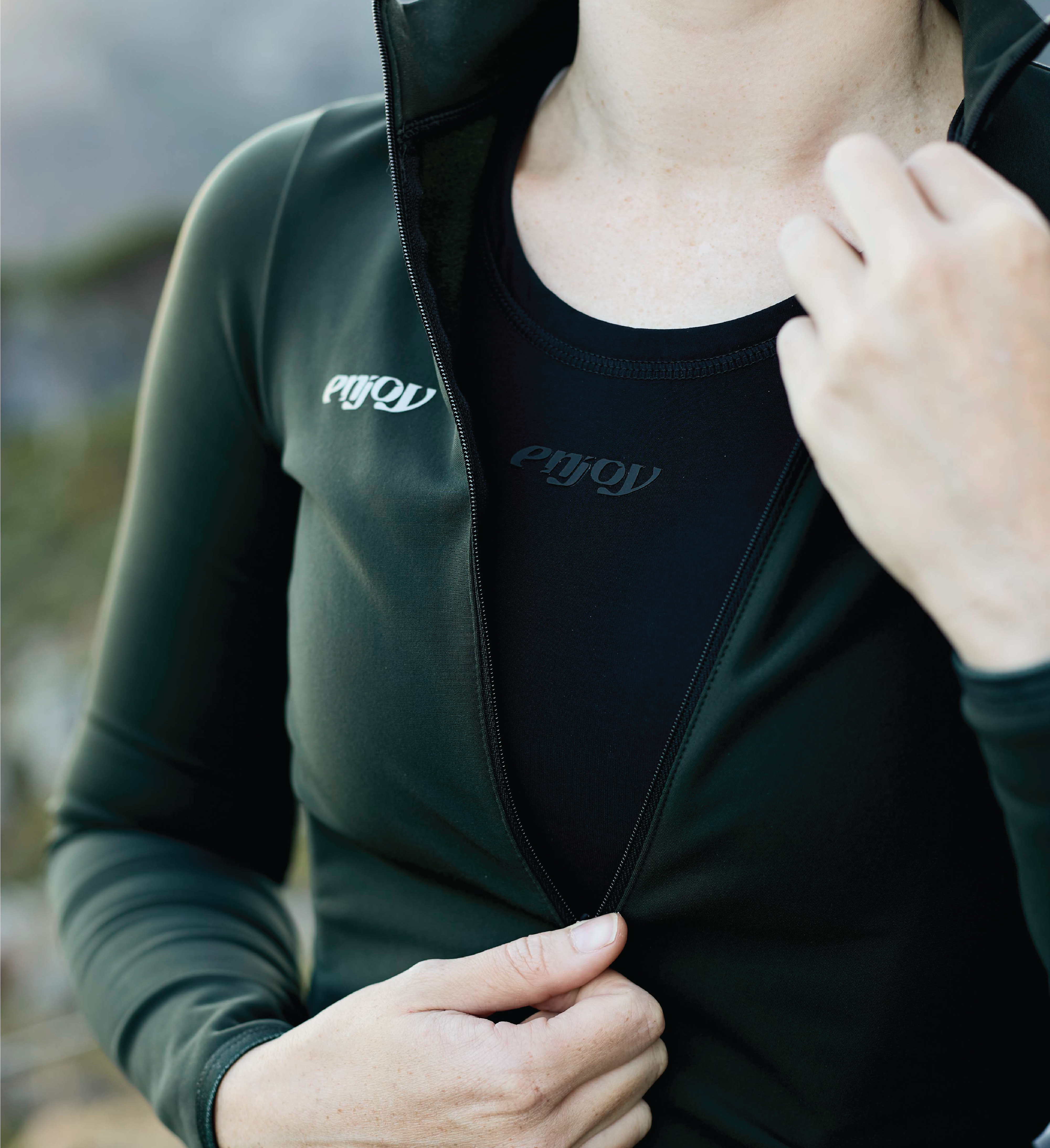 Female cyclist wearing a thermal base layer made by Enjoy.cc