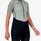 Side view of the women's sleeved triathlon suit in a green and black design made by enjoy.cc