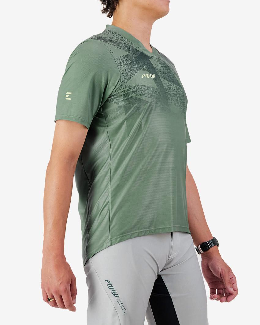 Side view of the Enjoy men's Enduro Trail Tee in Green with reflective detailing made by Enjoy.cc