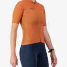 Side view of the Womens Supremium cycling jersey in a solid Clay colour way by Enjoy.cc