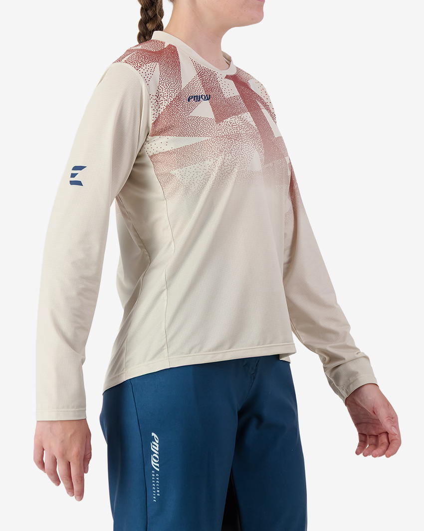 Side view of the Enjoy Women's Enduro Long Sleeve Trail Tee in Beige made by Enjoy.cc