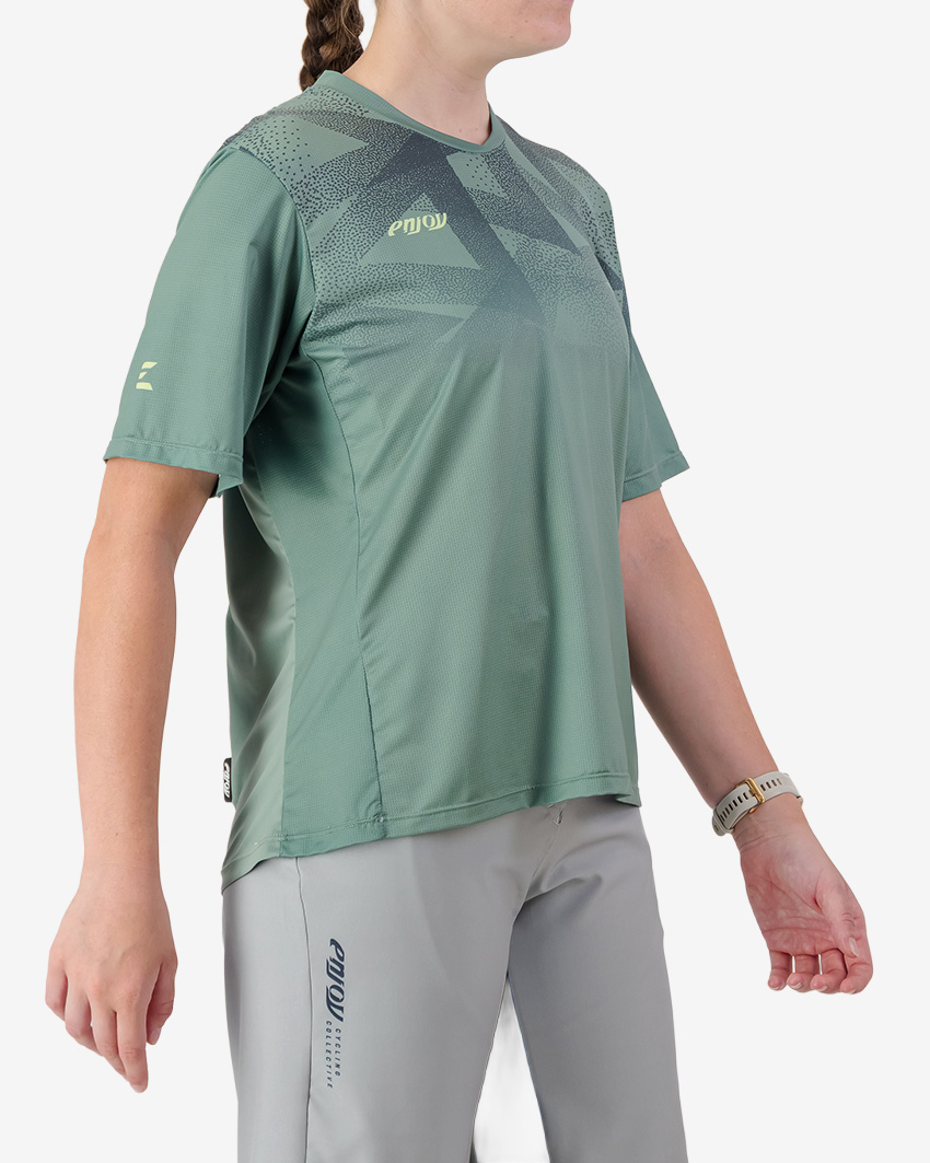 Side view of the Enjoy Women's Enduro Trail Tee in Green with reflective detailing made by Enjoy.cc