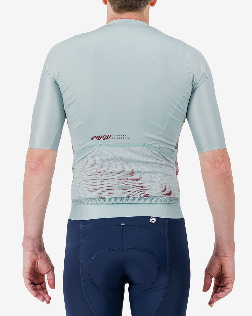 Back view of the Men's ProXision cycling jersey for in teal glitch colour way by enjoy.cc